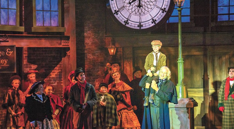 center Anthony Newmann plays Tiny Tim and Dirk Lumbard plays Ebenezer Scrooge in Lyric Theatre&#146;s A Christmas Carol. | Photo KO Rinearson / Lyric Theatre of Oklahoma / provided