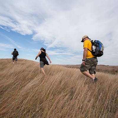 Hikers trek the grasses of Four Canyon Preserve in western Oklahoma as part of a field trip with the Oklahoma chapter of The Nature Conservancy. | Photo Ryan West / The Nature Conservancy / provided