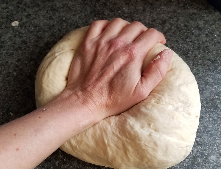 Jessica Bennett prepares bread in her home kitchen for Country Girl Kitchen.