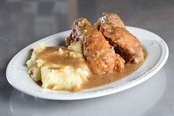 Smothered chicken and mashed potatoes (Garett Fisbeck)