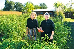 Chefs Kamala Gamble and Barbara Mock use fresh produce from Guilford Garden's fall crop. (Shannon Cornman)