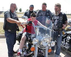 Motorcycle group holds event to raise money for special needs camp scholarships