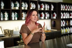 Urban Teahouse owner Kristy Jennings explains the brewing process. (Garett Fisbeck)
