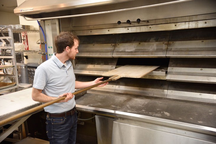 Baker Cameron Campbell shows off Esca Vitae&#146;s three-deck oven imported from France. (Photo Jacob Threadgill)